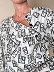 Blusa Yves Saint Laurent in tessuto jacquard bianco e nero fantasia Domino