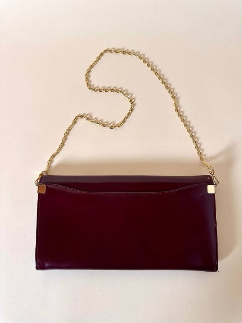 Pochette in pelle spazzolata bordeaux con tracolla in catena