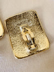 Maxi orecchini a clip dorati con logo YSL 