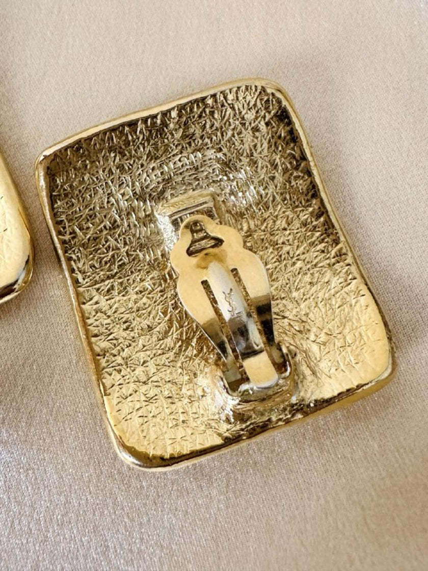 Maxi orecchini a clip dorati con logo YSL 