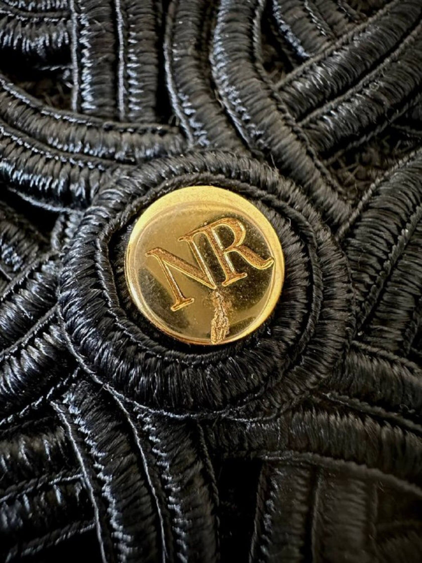Pochette a busta in passamaneria nera con tracolla “Nina Ricci”