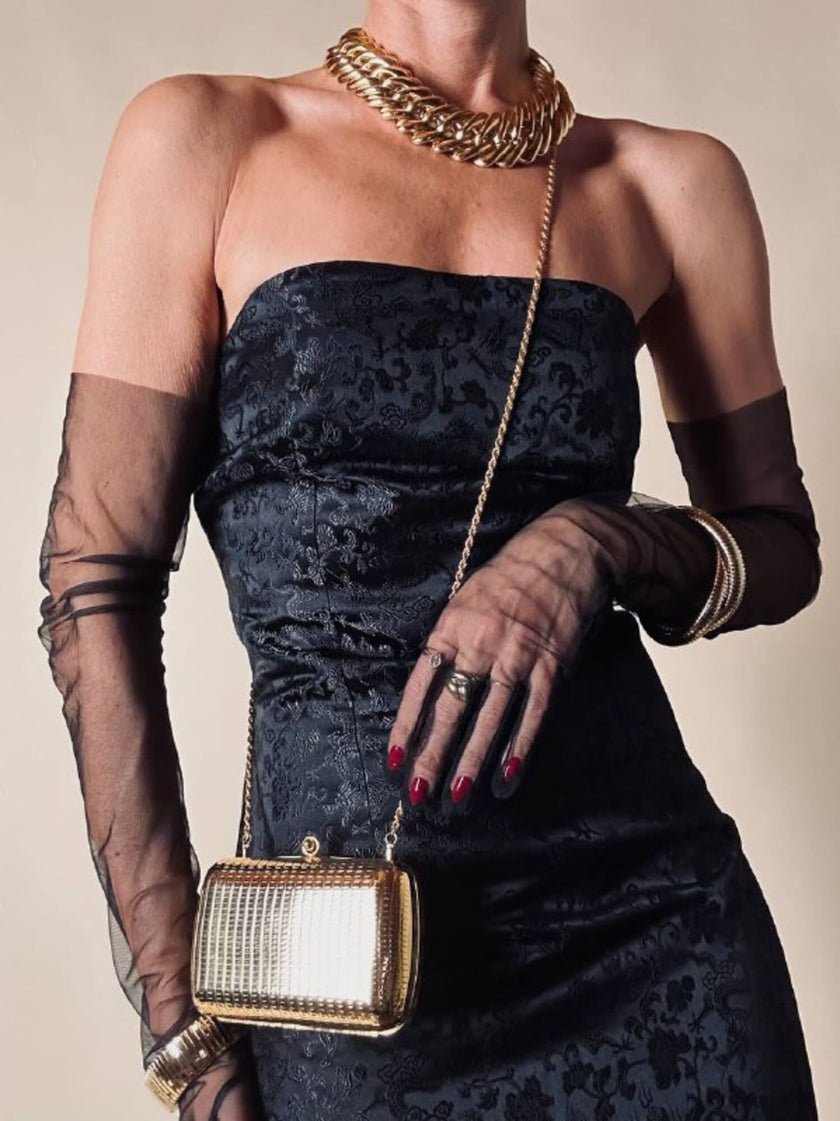 Mini clutch in metallo oro con tracolla in catena