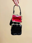 Mini bag artigianale in pitone nero con fodera rossa