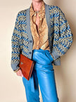 Cardigan Missoni Sport con pattern geometrico e trama tridimensionale nei toni del verde e blu