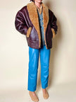 Shearling reverse in pelle liscia marrone castagno con vello caramello e ricamo sul fondo