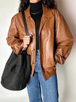 Secchiello vintage Yves Saint Laurent in tessuto nero millerighe con riporti in pelle