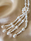 Collana lunga con nappa realizzata con perle naturali d’acqua dolce