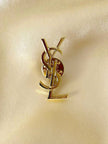 Spilla logo Yves Saint Laurent color oro