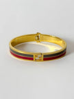 Bracciale vintage Fendi in metallo oro rifinito con smaltato grigio e rosso