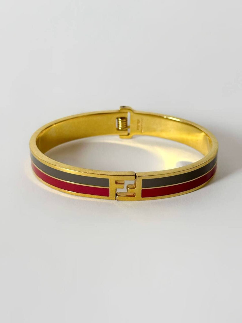 Bracciale vintage Fendi in metallo oro rifinito con smaltato grigio e rosso