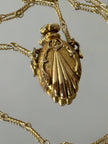 Collana vintage dorata con ciondolo a forma di bottiglia di profumo
