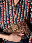 Vintage Roger Vivier leopard-print python clutch with a distinctive rectangular gold-tone metal clasp