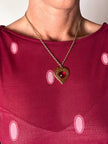 Collier vintage Yves Saint Laurent con ciondolo a forma di cuore firmato e cabochon rosso