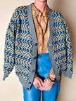 Cardigan Missoni Sport con pattern geometrico e trama tridimensionale nei toni del verde e blu