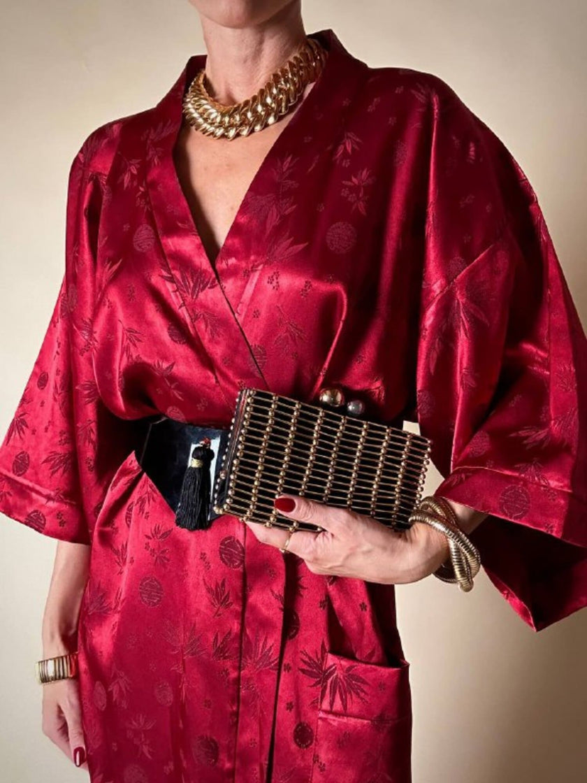 Clutch gioiello in seta nera con armatura di perline dorate “Rodo”