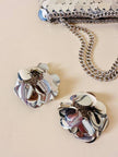 Parure composta da clip e mini bag in paillettes argento