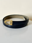 Cintura vintage Yves Saint Laurent in pelle nera con fibbia geometrica oro con logo YSL