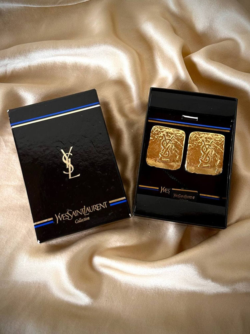 Maxi clip oro con logo “Yves Saint Laurent”
