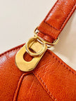 Borsa in pelle arancione zucca con doppi manici e hardware oro