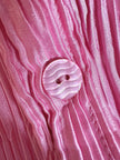 Camicia rosa in tessuto micro plissé con bottoni in madreperla “Ganni”