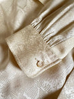 Blusa Yves Saint Laurent con fiocco al collo in seta jacquard avorio fantasia pitone
