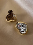 Clip dorate a forma di cuore con strass centrale
