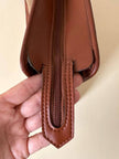 Borsa Yves Saint Laurent in canvas beige con profili color cuoio e motivo greca con logo