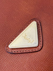 Pochette Yves Saint Laurent in saffiano color cuoio con accessorio logato oro