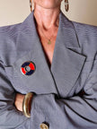 Spilla Yves Saint Laurent a forma di salvagente in metallo oro e smalto rosso e blu