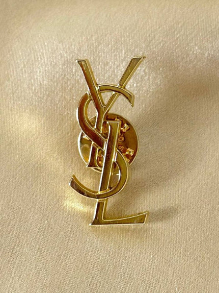 Spilla logo Yves Saint Laurent color oro