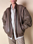 Bomber con maniche rimovibili in pelle color fango “Arpell”