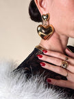 Maxi clip oro con cuori pendenti “Moschino”