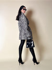 Collant vintage Yves Saint Laurent in lycra lucida nera con elastico logato