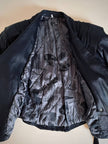 Biker vintage in pelle nera con cintura in vita e fodera couture