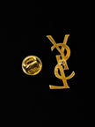Vintage Yves Saint Laurent logo brooch in gold-tone metal