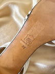 Sandali in pelle bianca con tacco a spillo “Yves Saint Laurent”