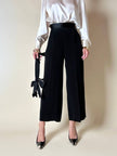 Pantalone nero con bretelle e maxi fiocchi in raso “Moschino Cheap and Chic”