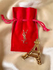 Spilla dorata Torre Eiffel “Yves Saint Laurent”