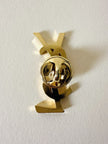 Spilla logo “Yves Saint Laurent”