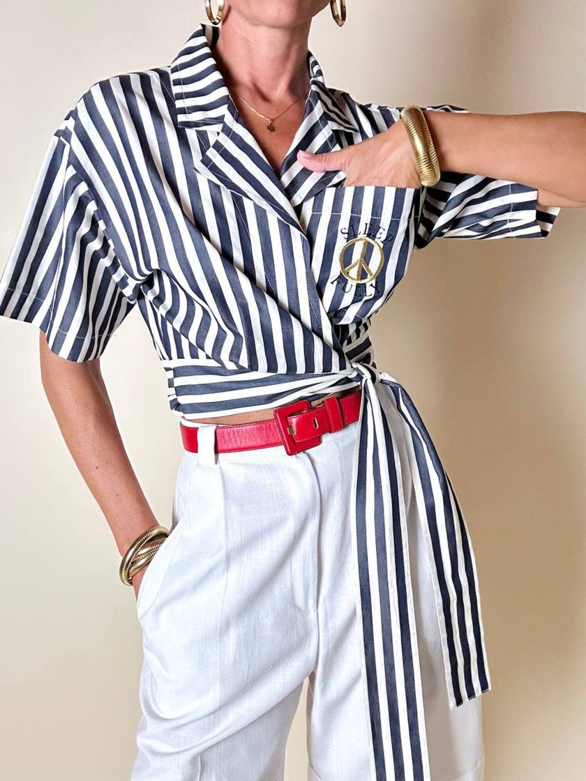 Moschino blue and white striped wrap blouse with embroidered peace symbol