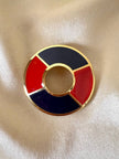 Spilla Yves Saint Laurent a forma di salvagente in metallo oro e smalto rosso e blu