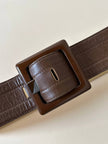 Cintura vintage Yves Saint Laurent in pelle marrone con maxi fibbia in resina