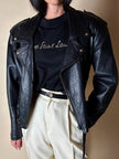 Maglia vintage Yves Saint Laurent in cotone nero con firma ricamata e bottoni dorati