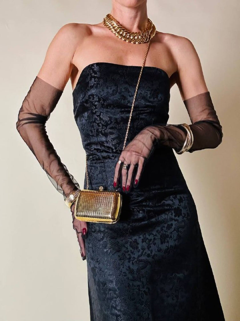 Mini clutch in metallo oro con tracolla in catena