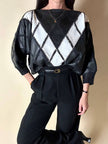Blusa vintage in pelle nera e bianca patchwork con lavorazione crochet e maniche a pipistrello