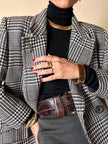 Spilla logo YSL dorata con dust nera “Yves Saint Laurent”
