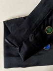 Gonna vintage Yves Saint Laurent Variation in raso nero con bottoni gioiello