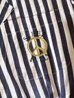 Moschino blue and white striped wrap blouse with embroidered peace symbol