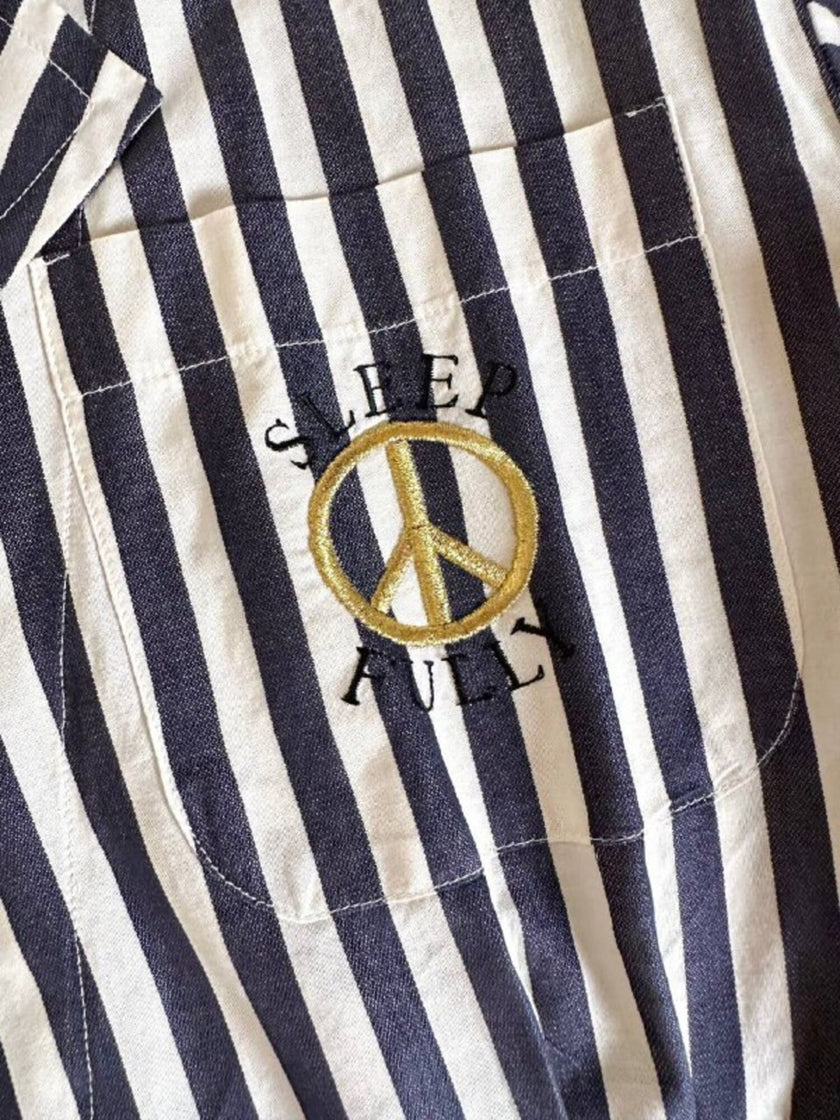 Moschino blue and white striped wrap blouse with embroidered peace symbol