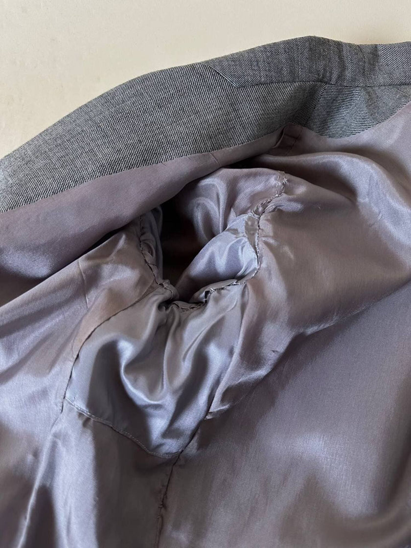 Giacca grigia con martingala “Yves Saint Laurent”